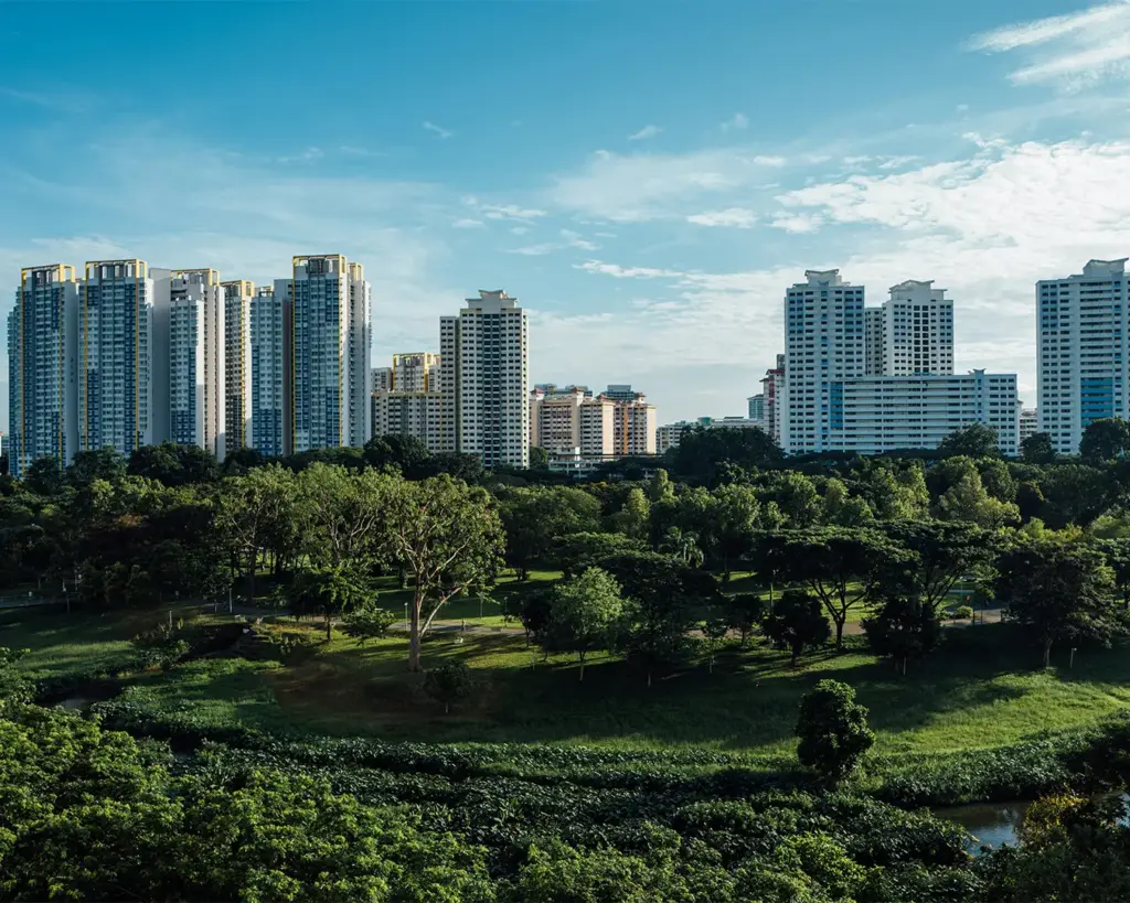 An elevated view overlooking residential and commercial buildings in Bishan, showing the organised city layout and greenery around the neighbourhood.