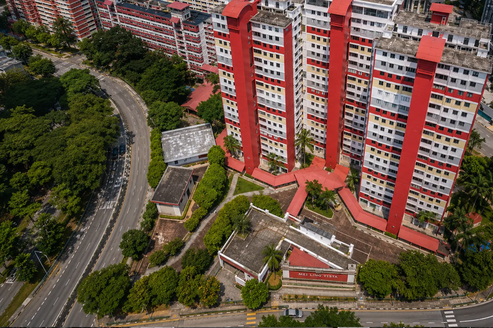 Aerial view of Mei Ling Vista red and white HDB blocks with unique architecture surrounded by lush greenery